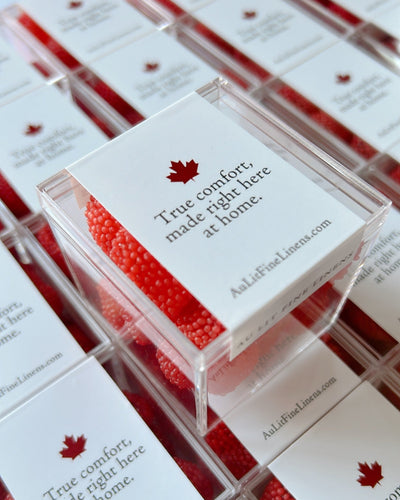Candy boxes with red candy with company logo