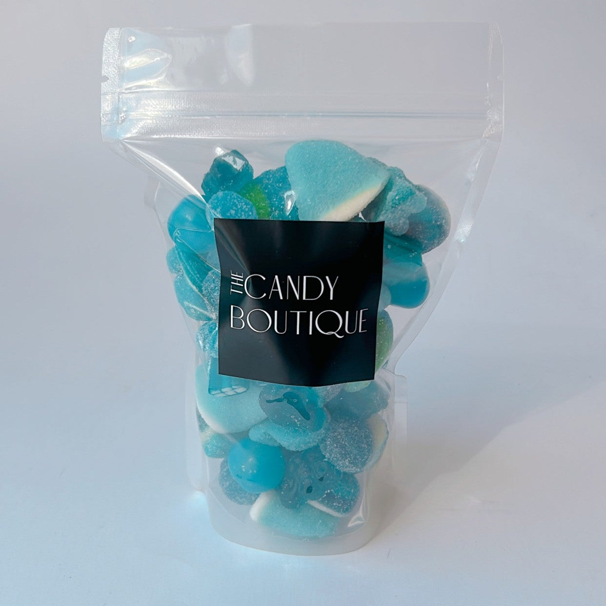 Candy bags containing blue gummy candy in assorted flavours
