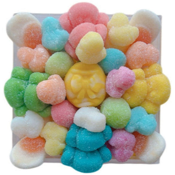 Easter and Spring-themed gummy candy arranged in a candy tray