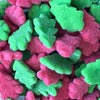 Gummy candy shaped in christmas trees in colours of red and gree