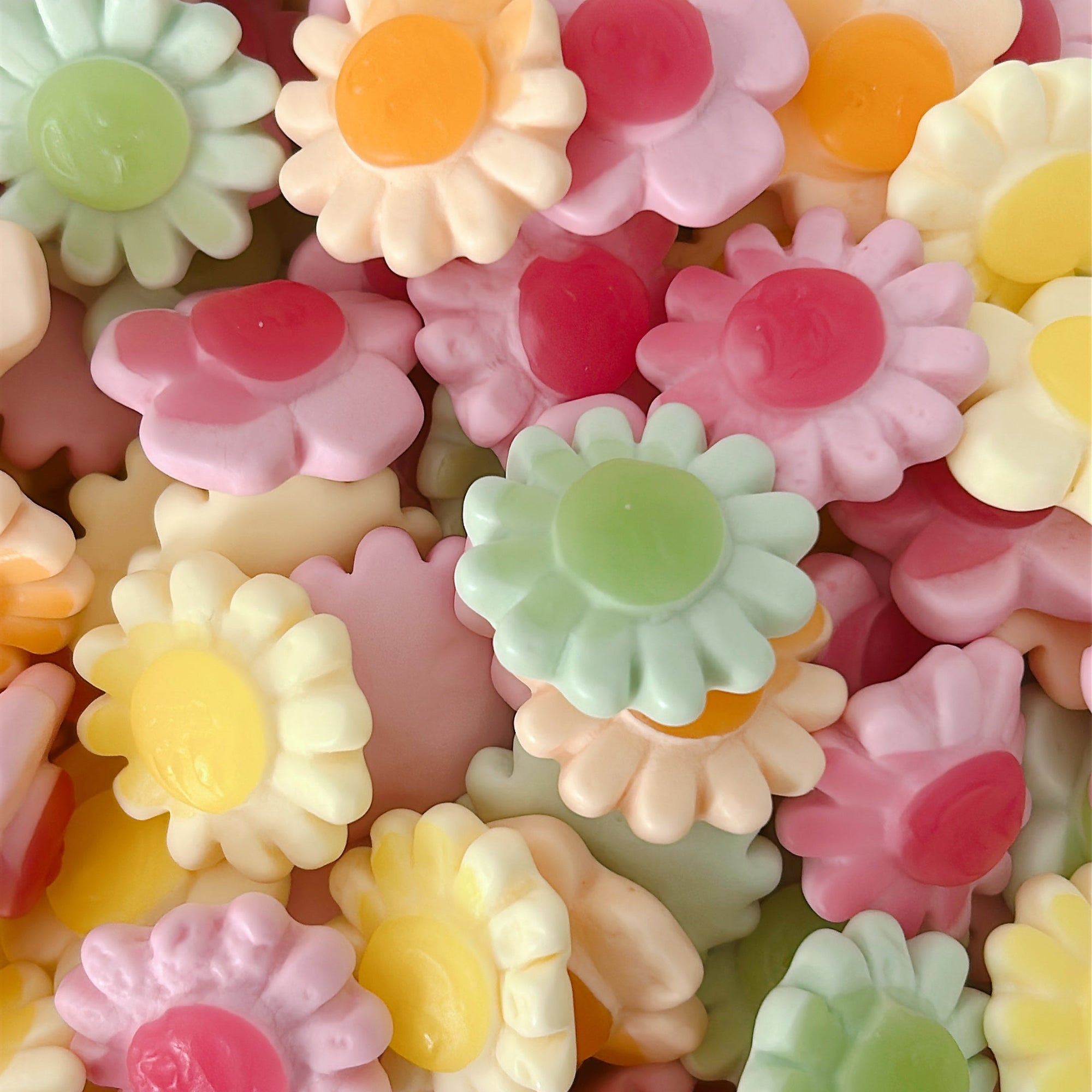 flower shaped gummy candy in a variety of pastel colours