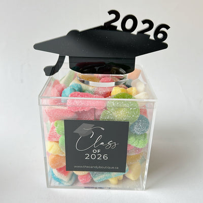 Clear candy box filled with assorted candy and  2026 cap on top