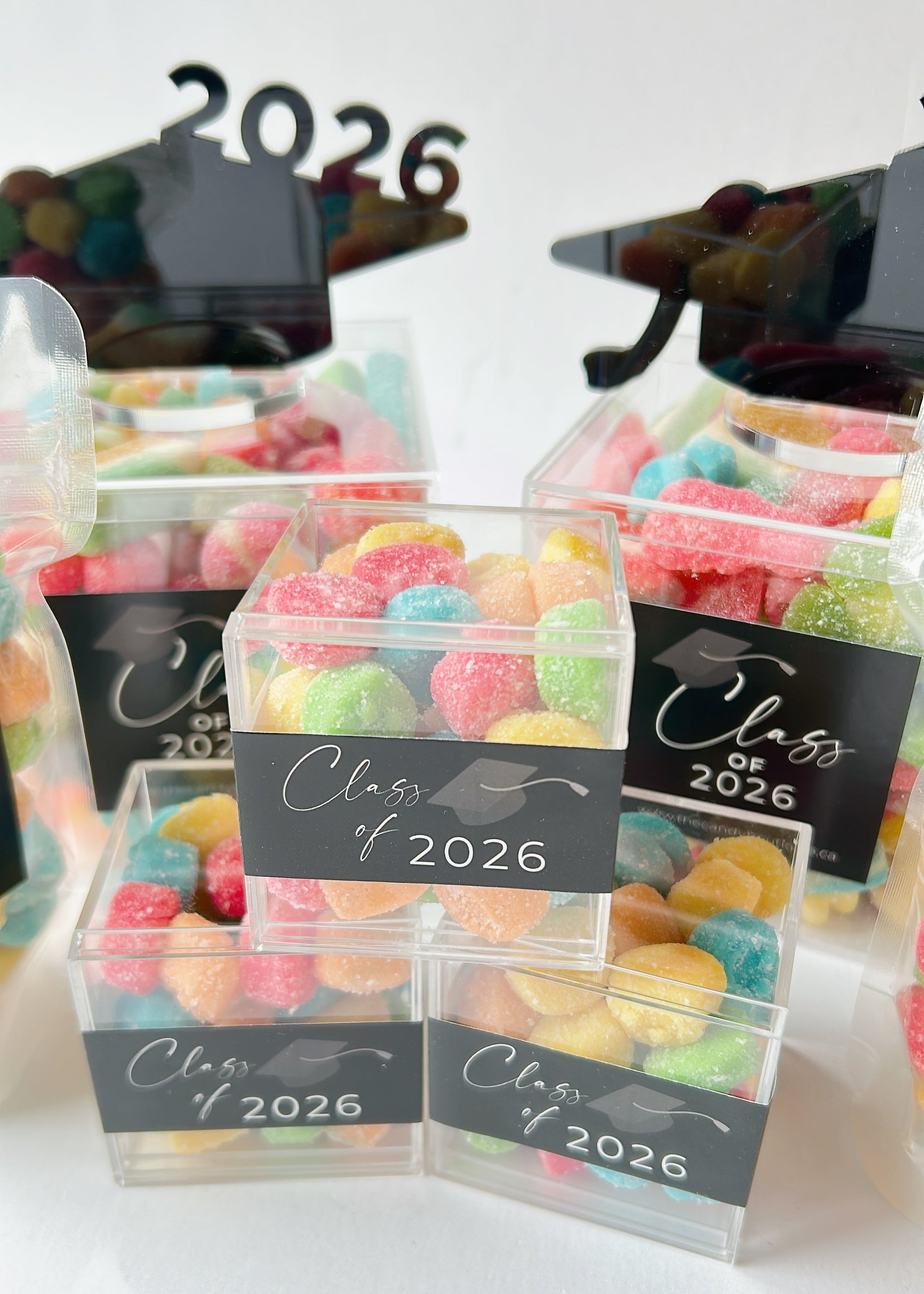 Clear acrylic candy boxes with a graduation label on front