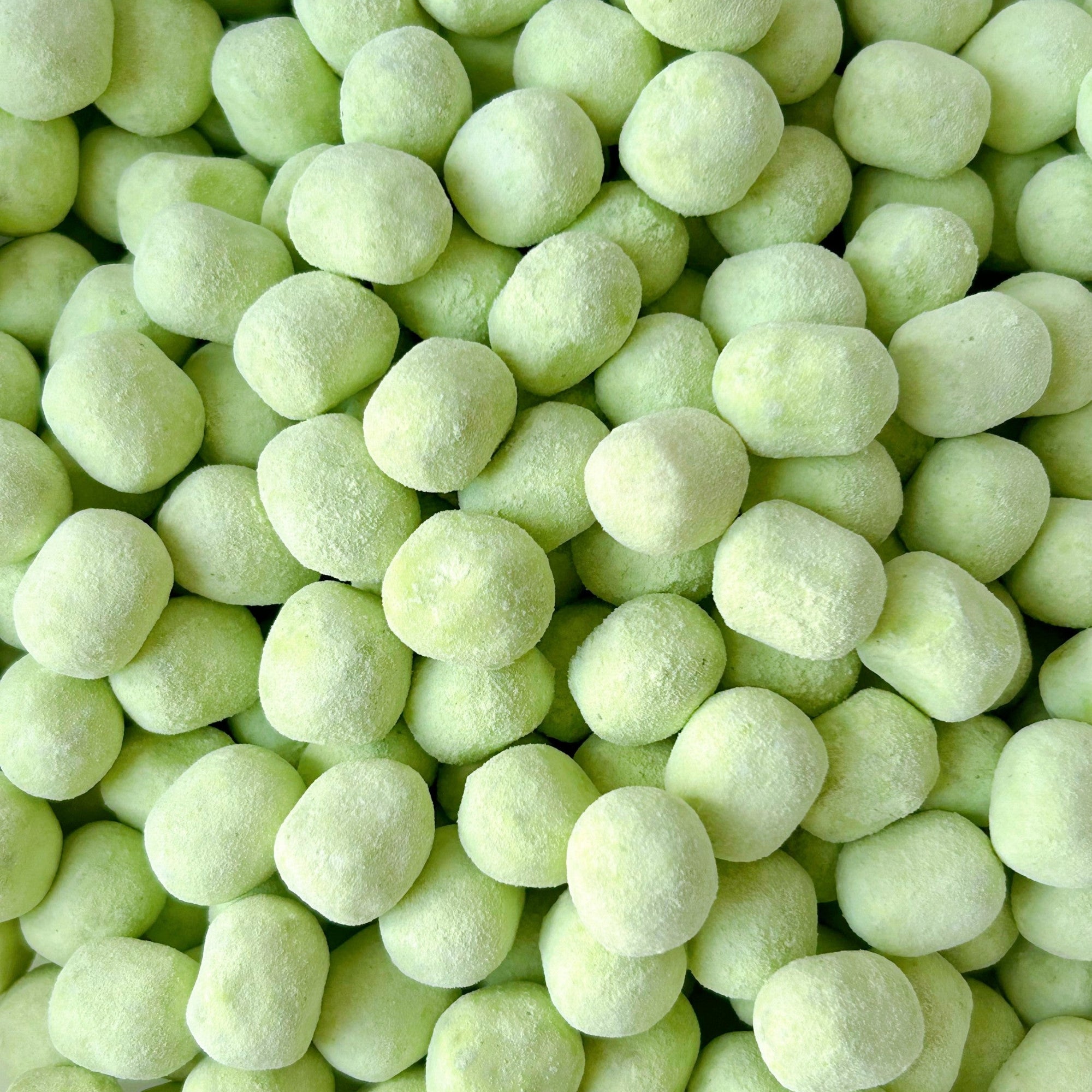 light green candy bonbons flavoured in green apple
