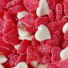 red and white shaped heart gummies