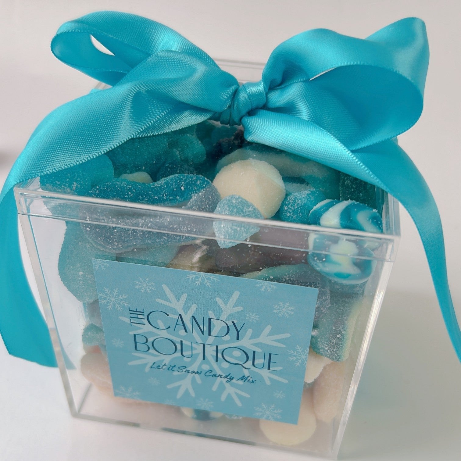 Blue and white snowflake themed candy gummies