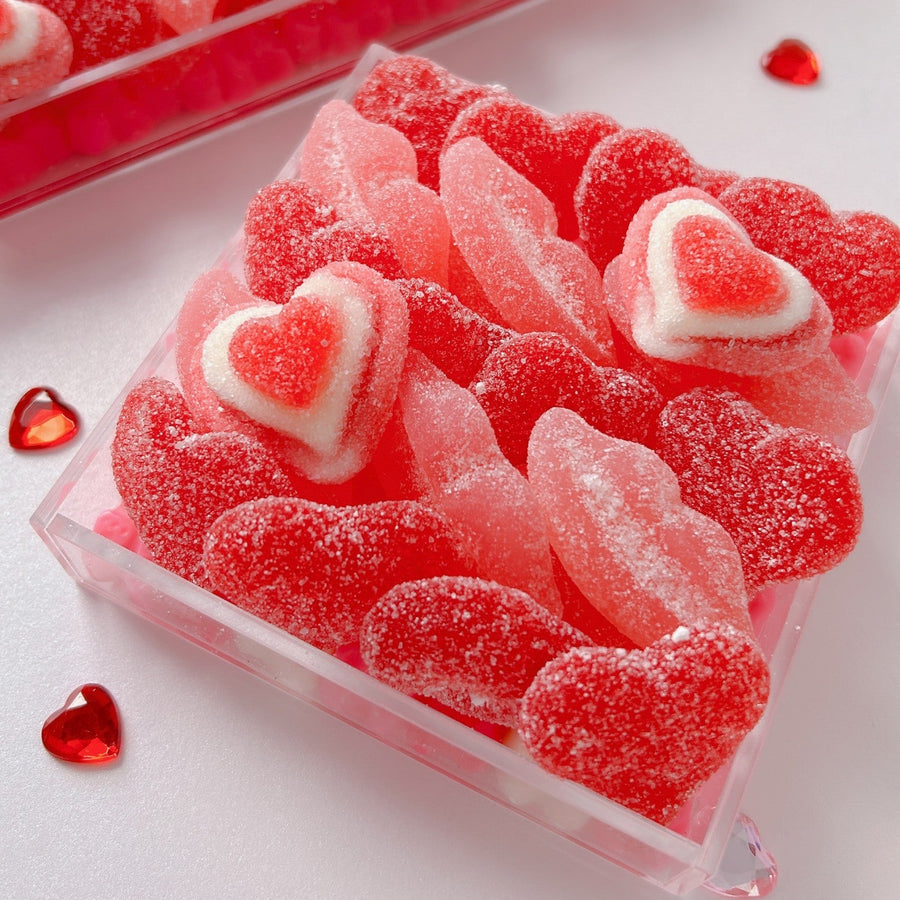 image of candy tray with heart and lip shaped gummy candy in pink and red colours