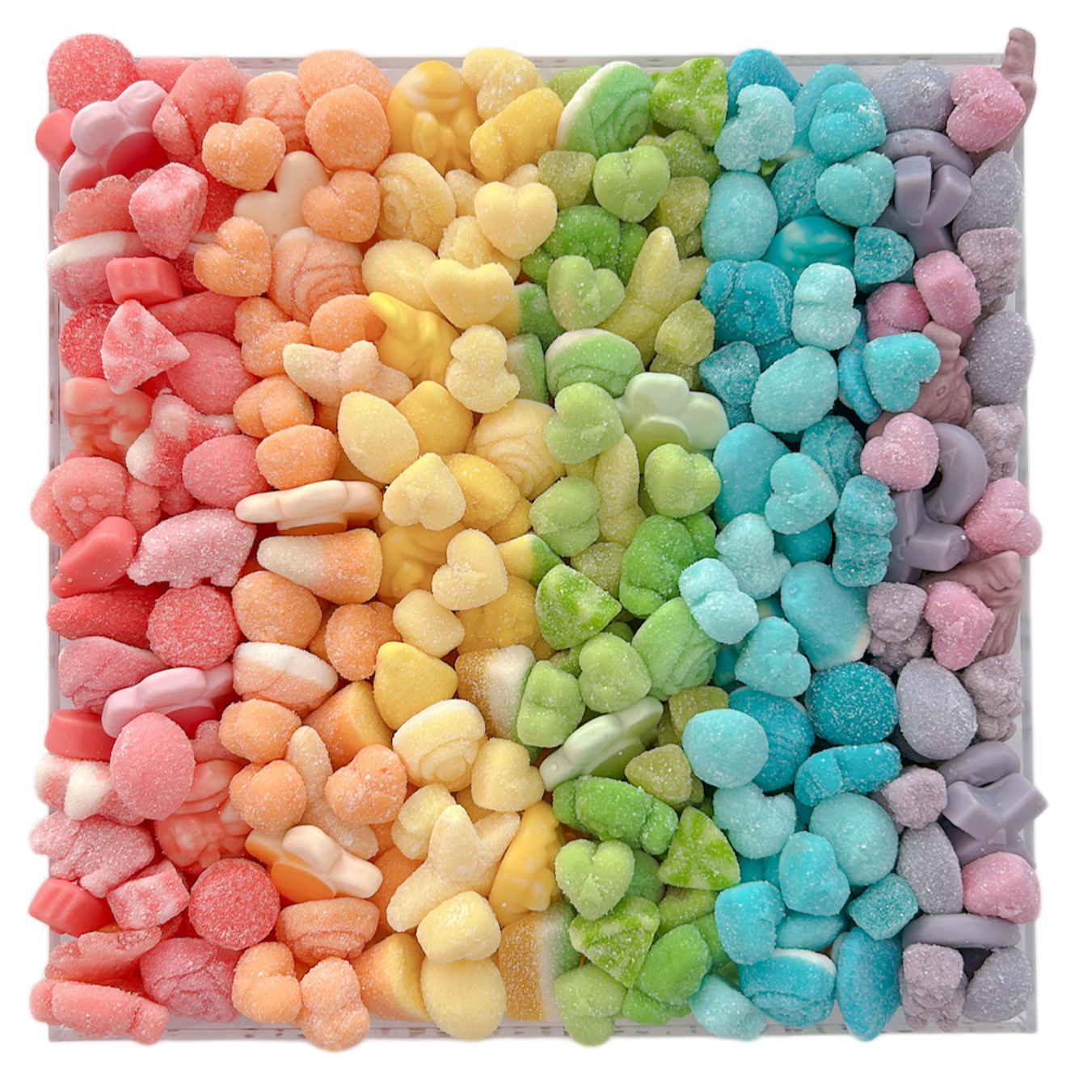 Colorful pastel gummy candy arranged in a rainbow pattern in an acrylic tray