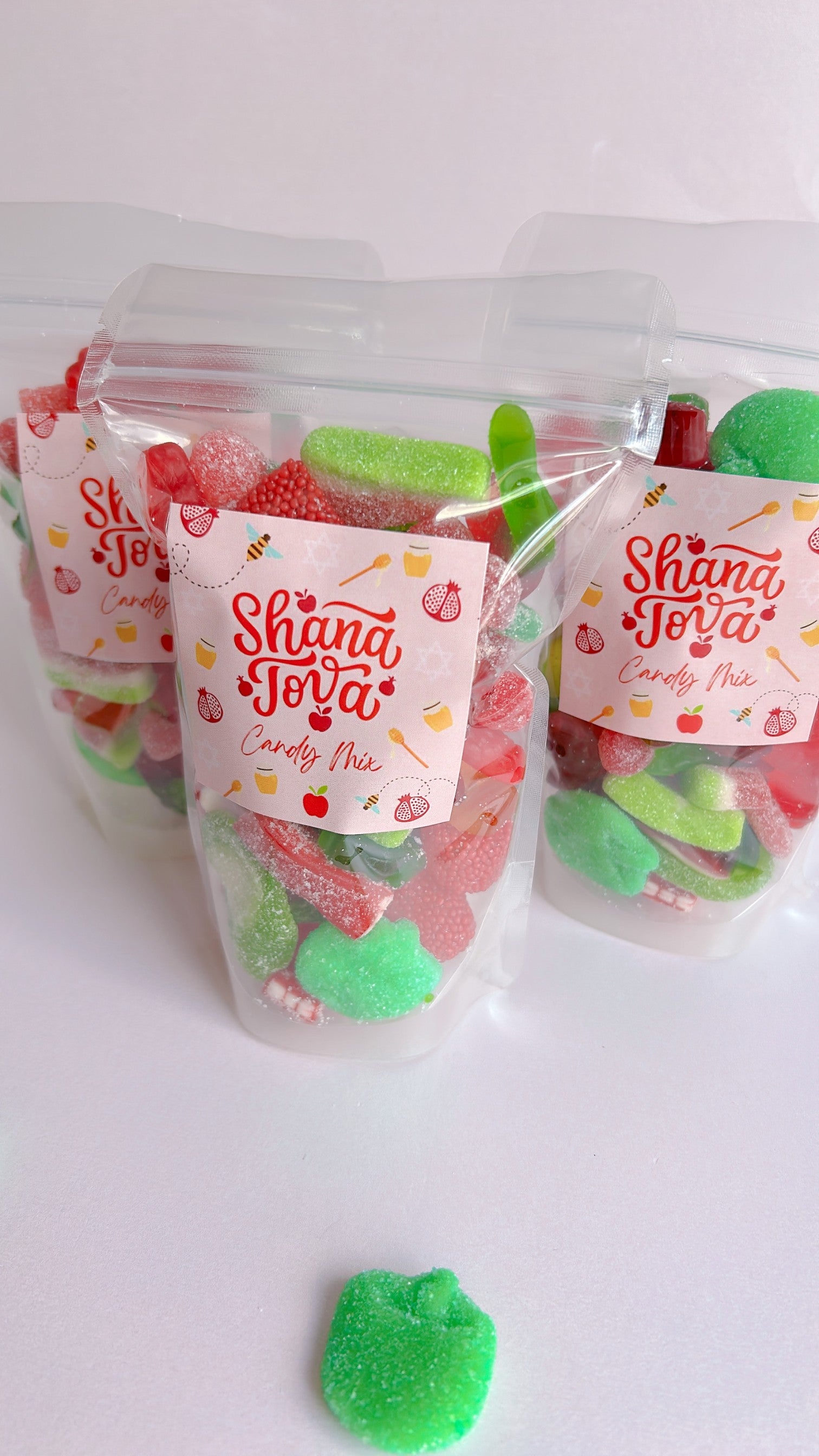 Clear packaging with colorful gummy candies and Shana Tova label on a