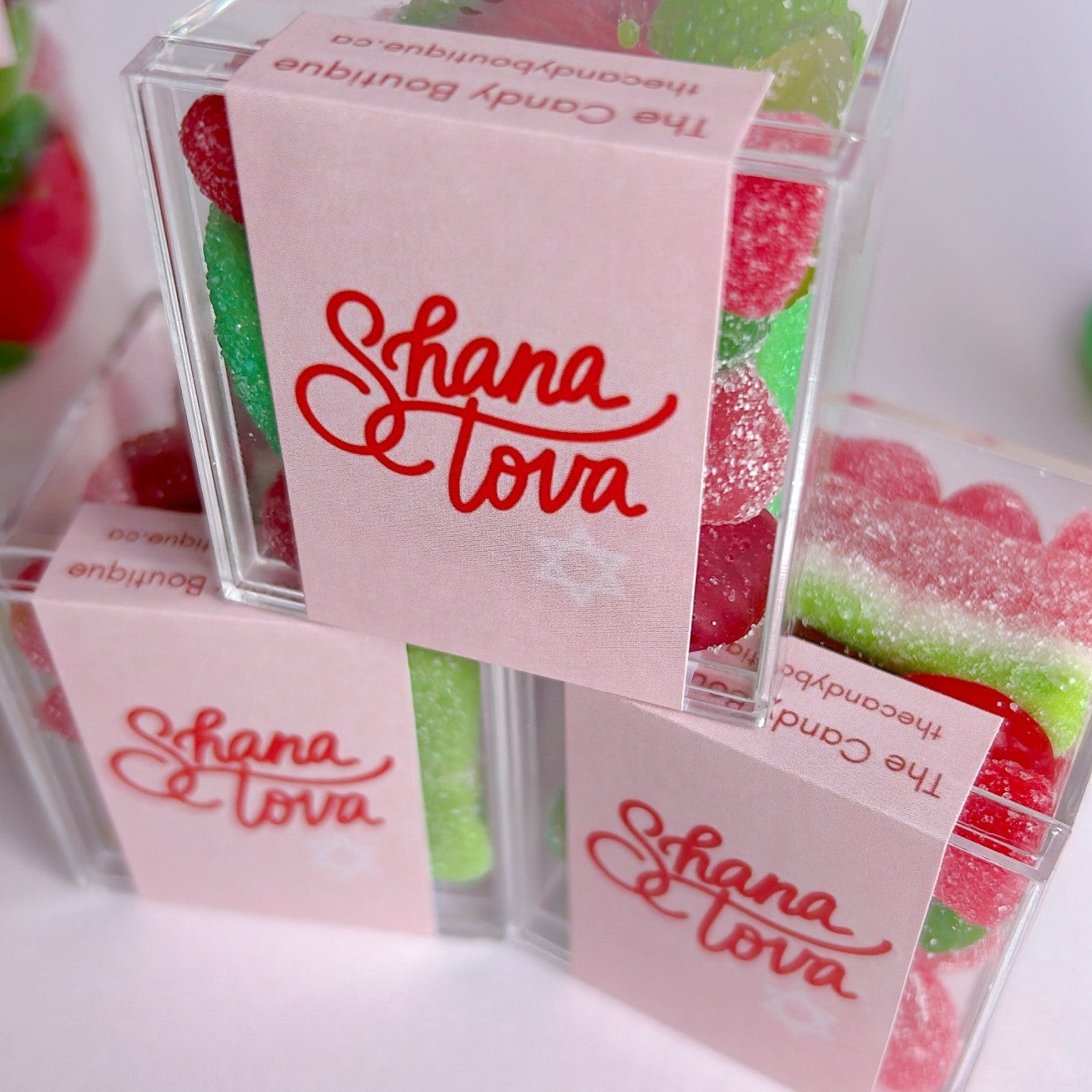 Gummy candy in a clear container with Shana Tova on the label