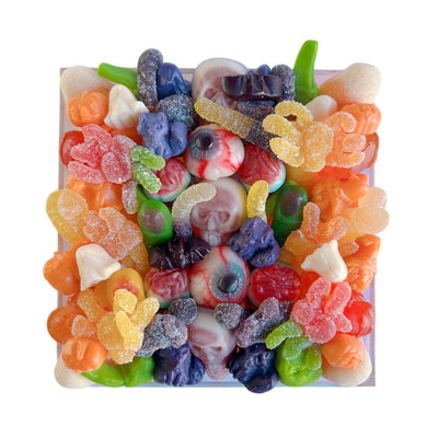 Colorful halloween-themed gummy candy in a medium acrylic tray