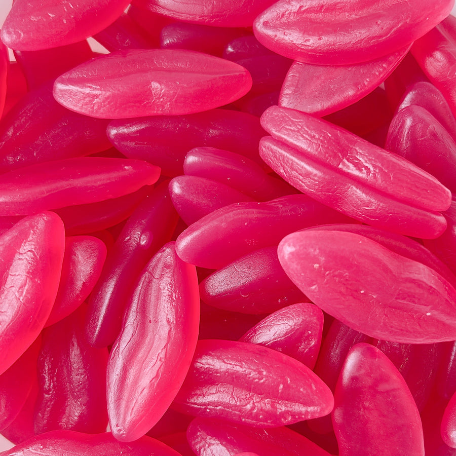 A pile of pink candy pieces shaped like lips