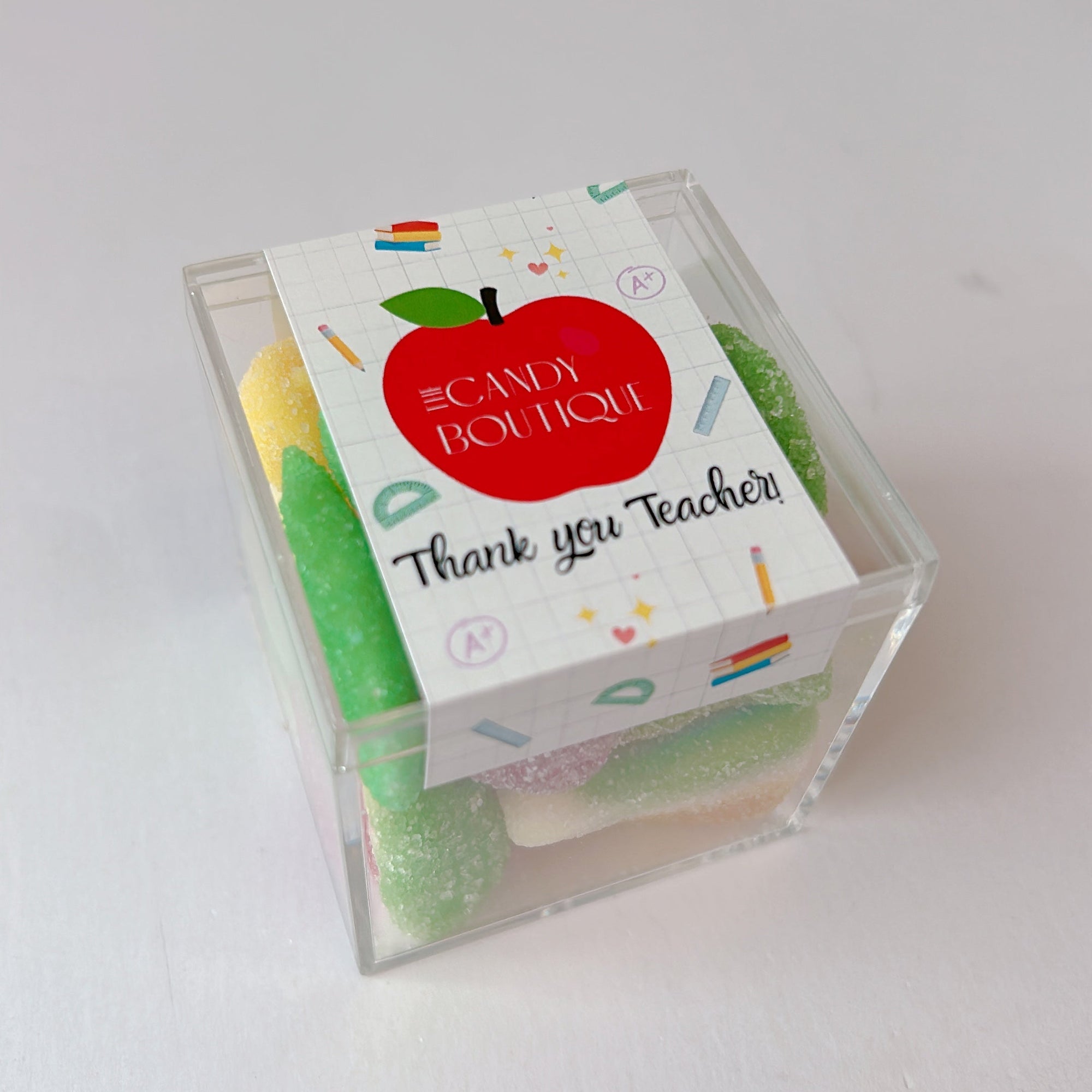 Small box with a red apple design and text on a white background