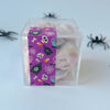 Image of candy cube with gummi skulls halloween candy