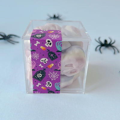 Image of candy cube with gummi skulls halloween candy